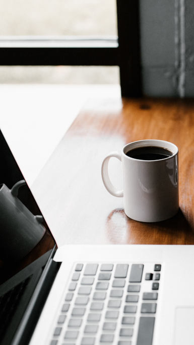 coffee and laptop on desk