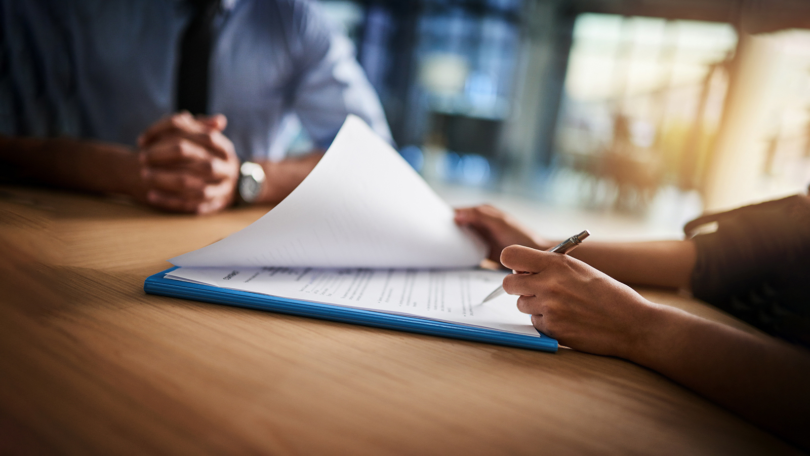 someone signing a document 