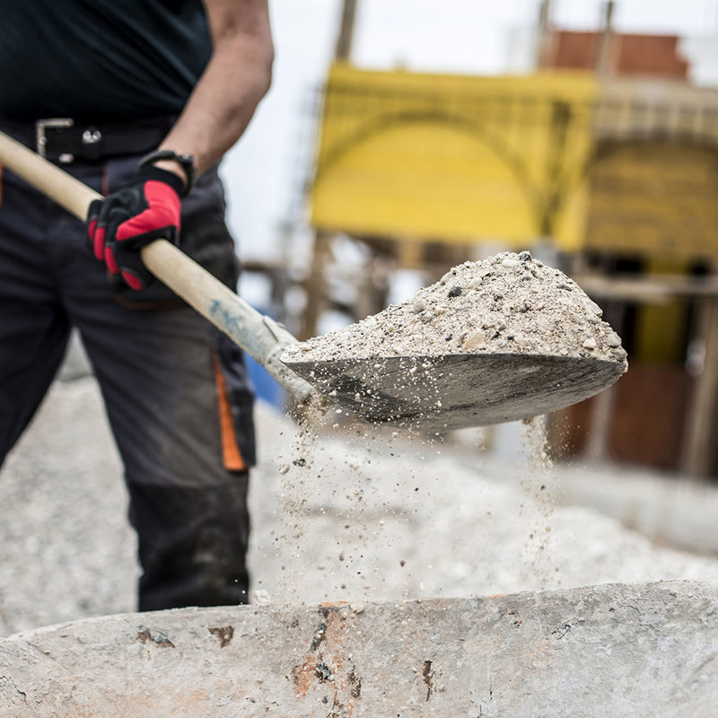 shoveling concrete