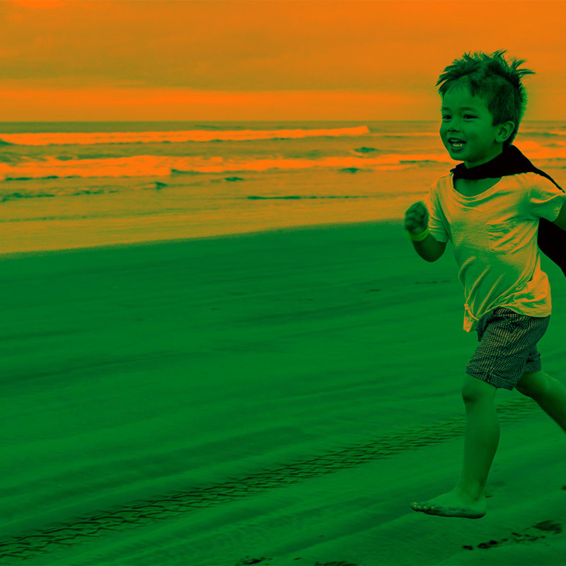 boy running on beach