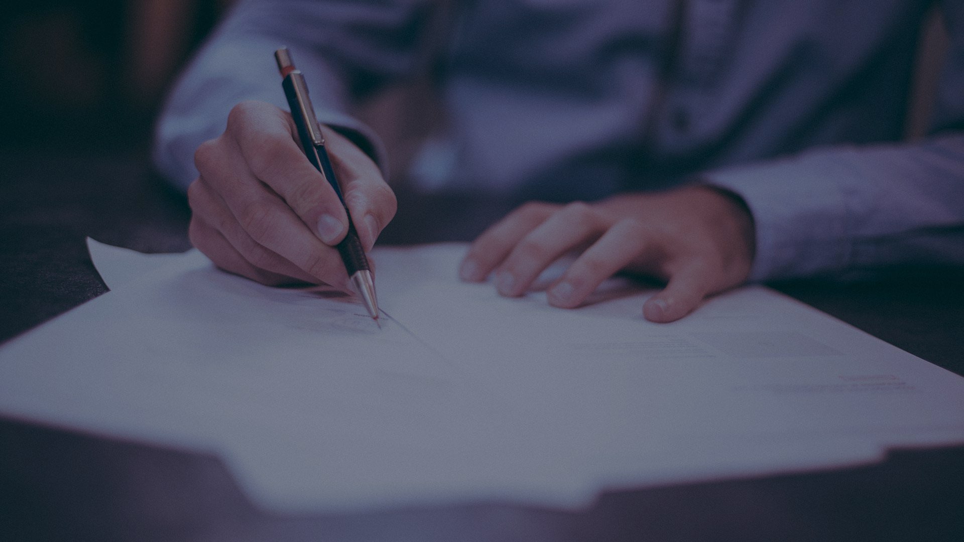 man completing paperwork 