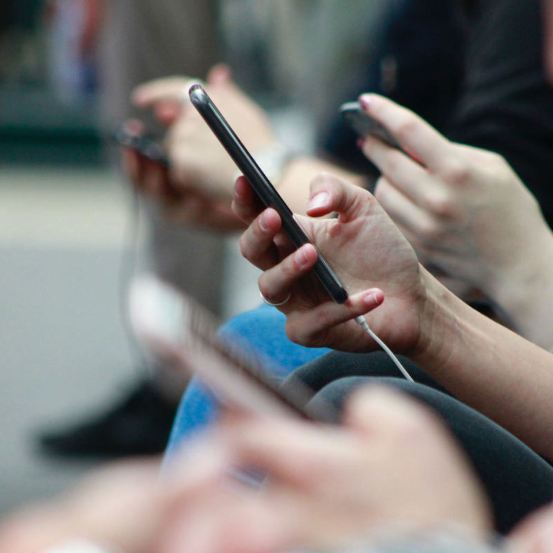 people using their mobile phones