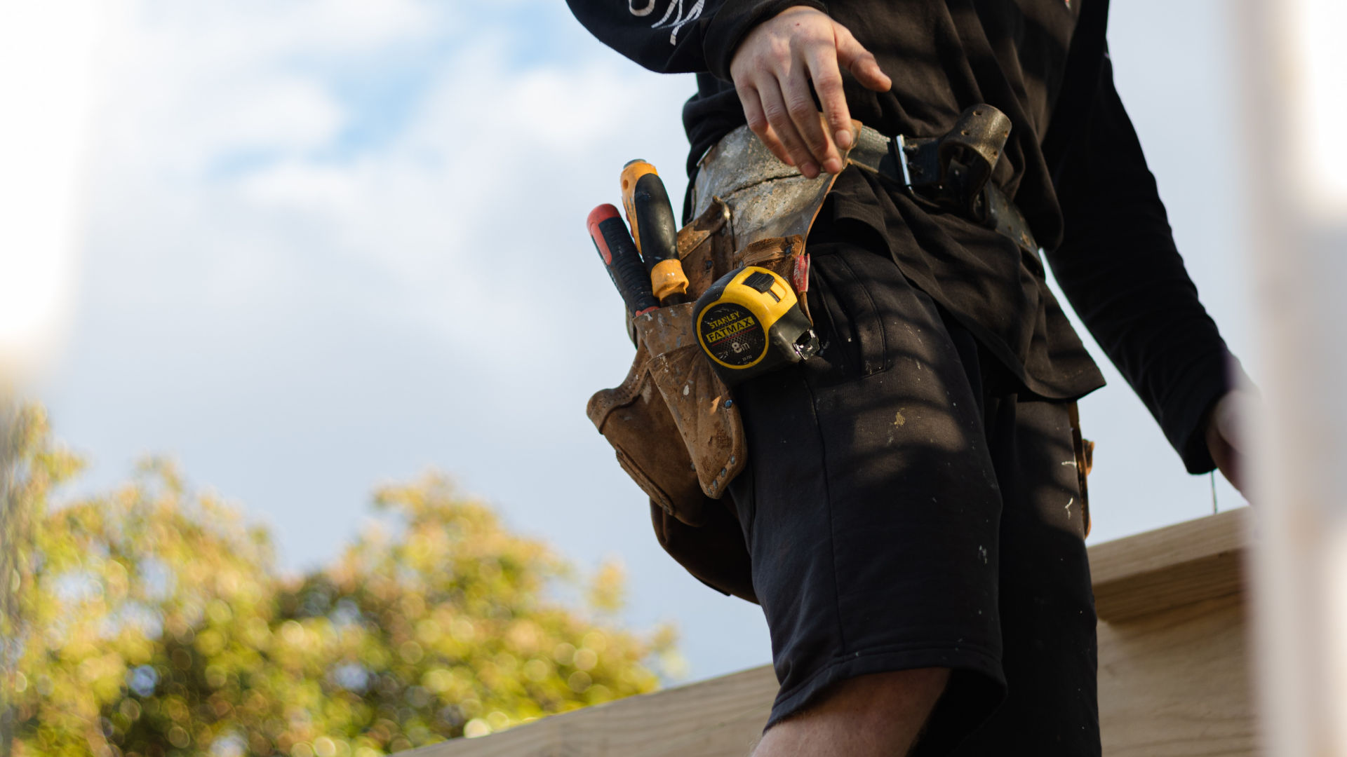 builder with a tool belt 